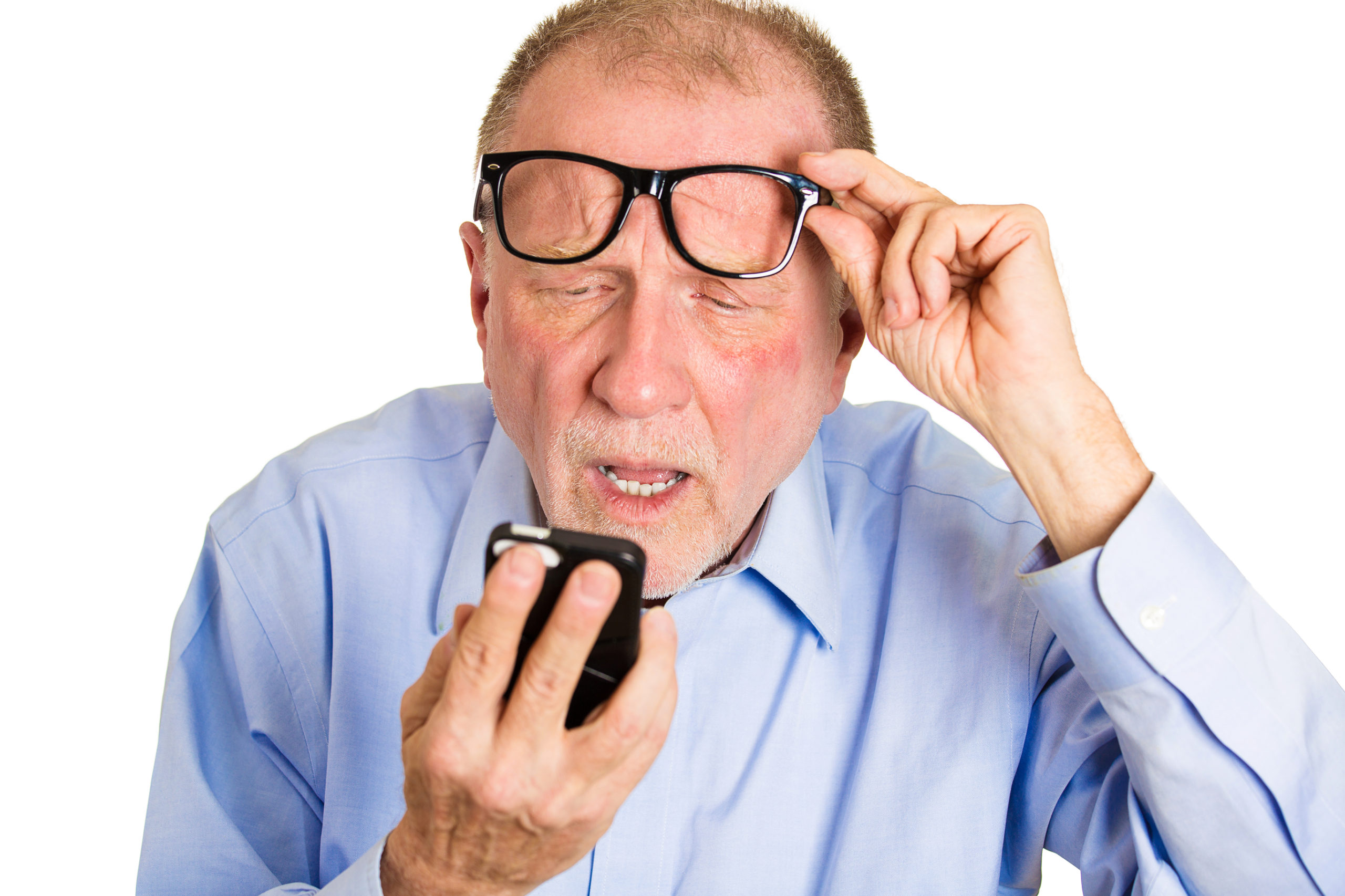 senior man squinting at cell phone