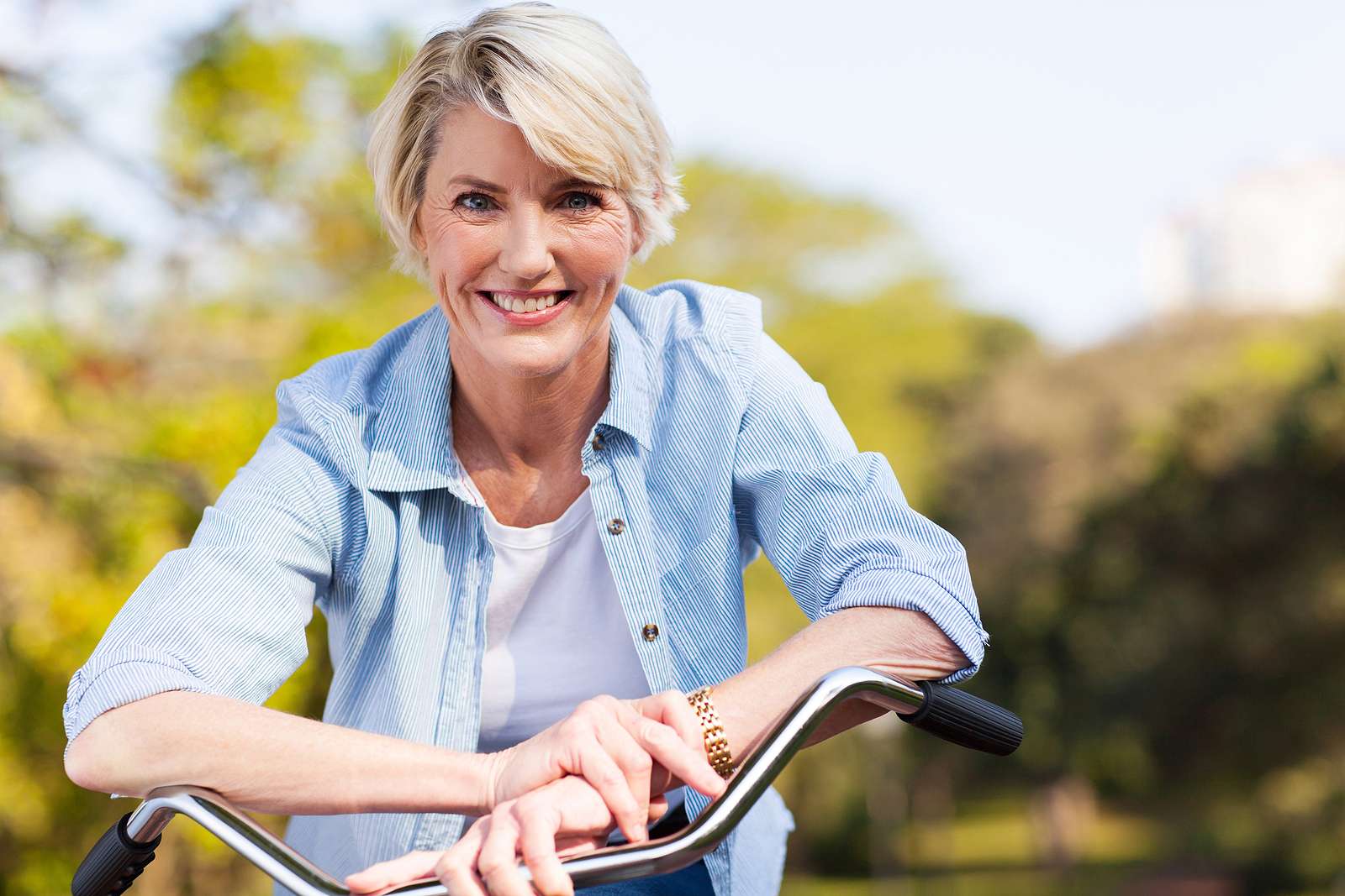 older woman on bicycle - eye care patient