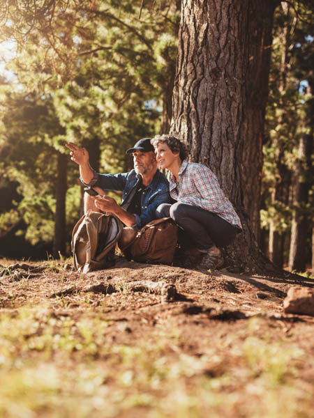 older couple enjoying the woods after cataract surgery in Evergreen Colorado