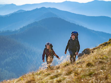 young couple hiking after lasik surgery in Thornton colorado