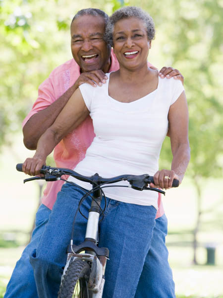 older couple biking after cataract surgery in Windsor Colorado